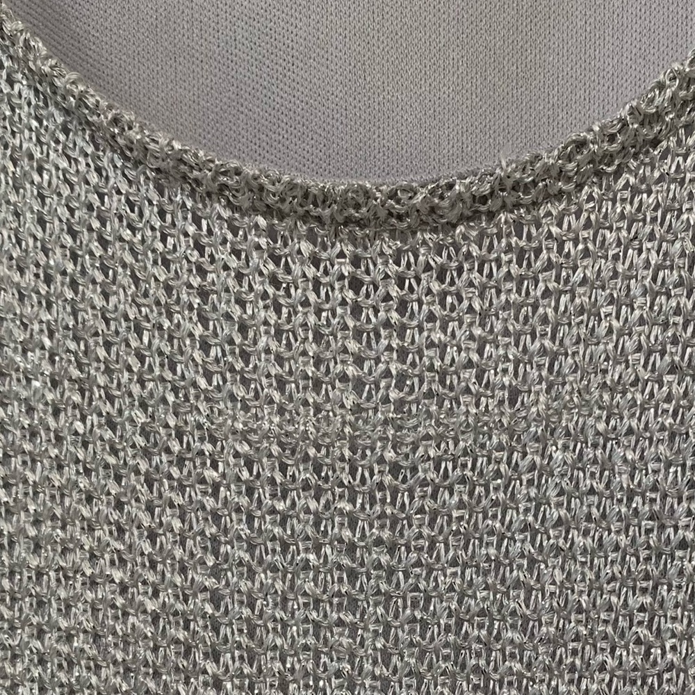 Sleeveless dress, silver knit, with light gray lining. Size 6-8 made by Promod